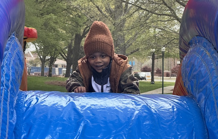 A child plays on a slide