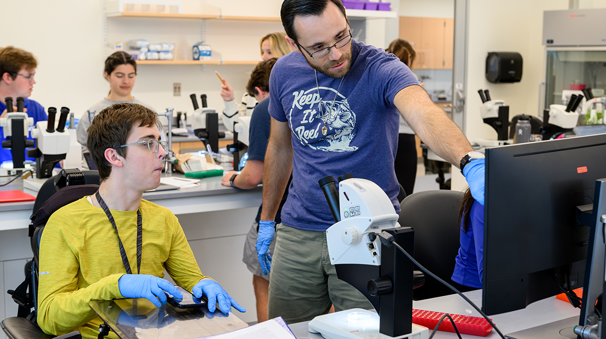 A student participates in the daily assignment with assistance from an instructor in Dr. Millie Mulero’s Biology Lab classes at The Duff Center 