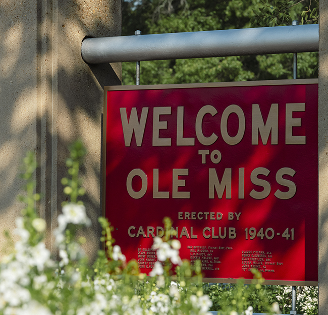 The red Welcome to Ole Miss sign near the grove erected by the Cardinal Club