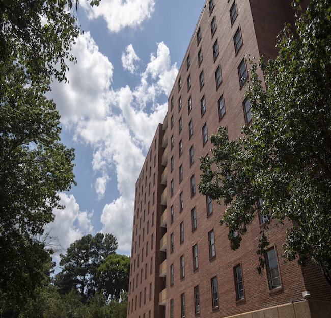 Photo of the outside of Crosby Hall with trees. 