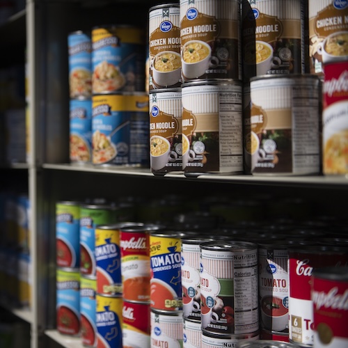 Grove Grocery shelves with canned goods, one of many offerings 