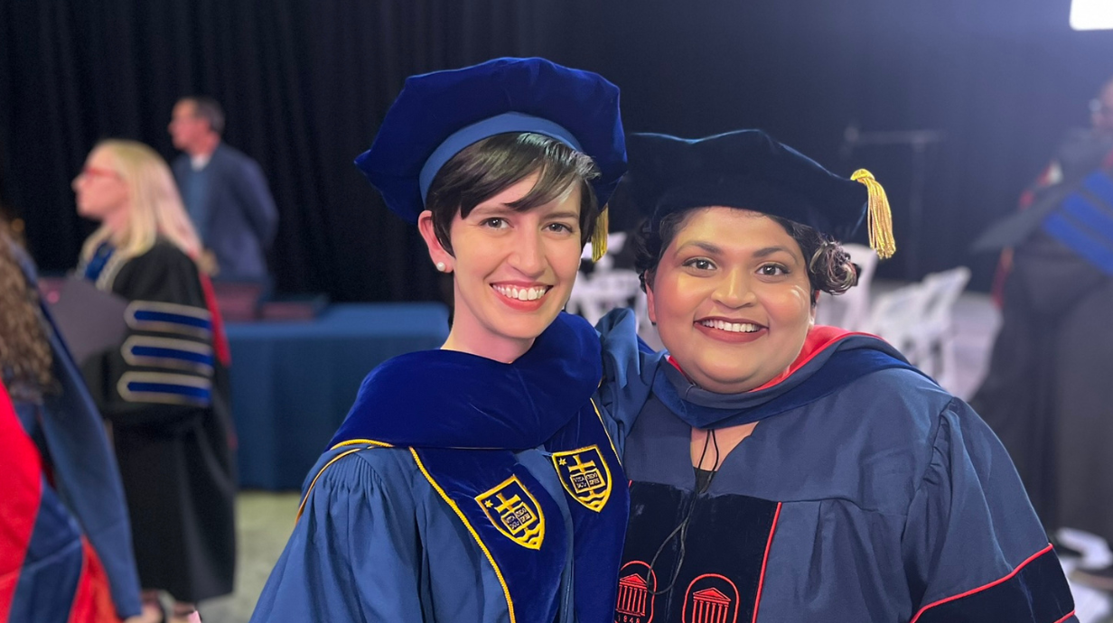 Emily Pitts Donahoe and Apoorva Mate celebrate Apoorva's Graduate Excellence in Teaching Award at the 2024 doctoral hooding ceremony.