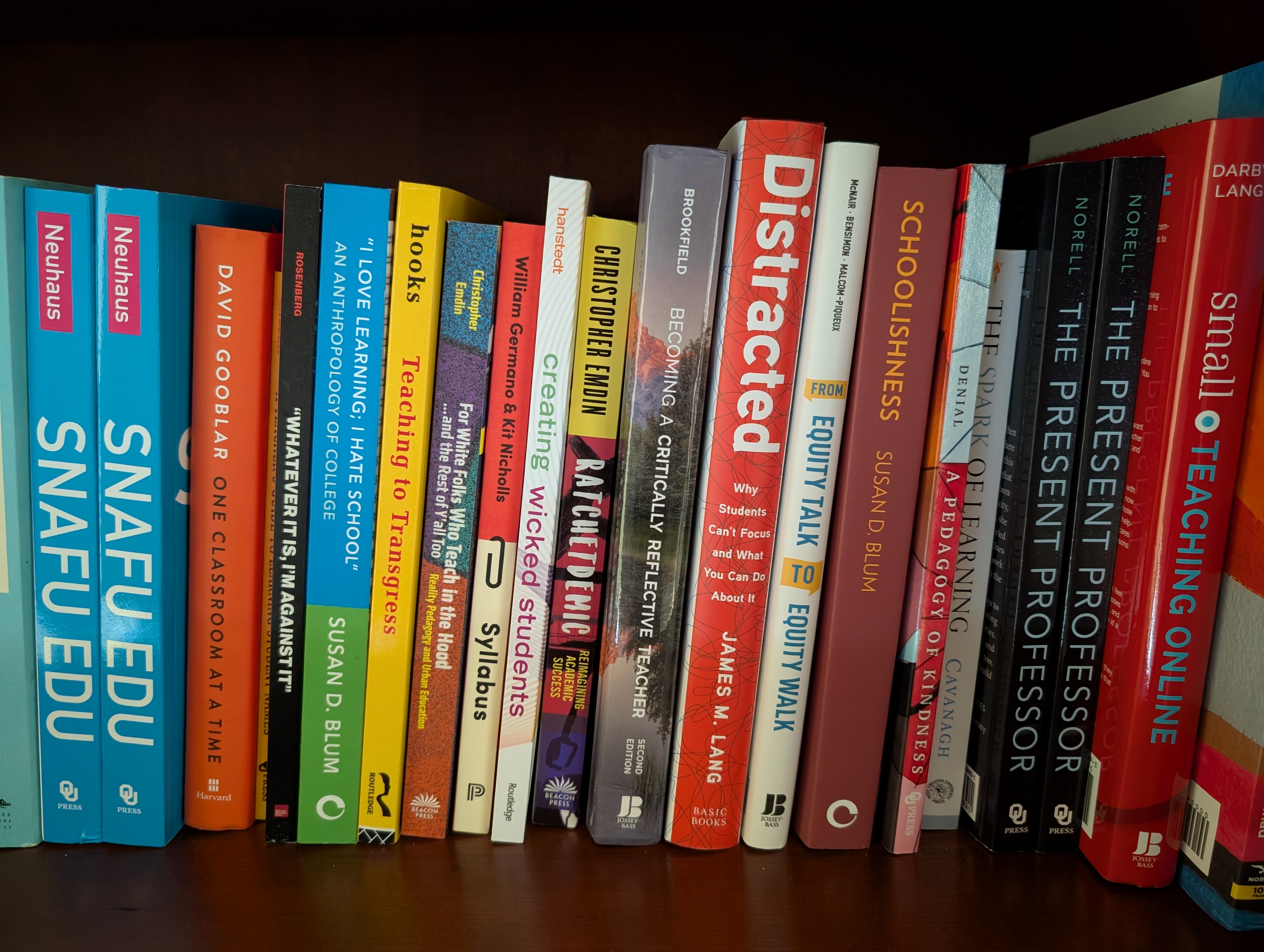 An array of teaching books on a bookshelf