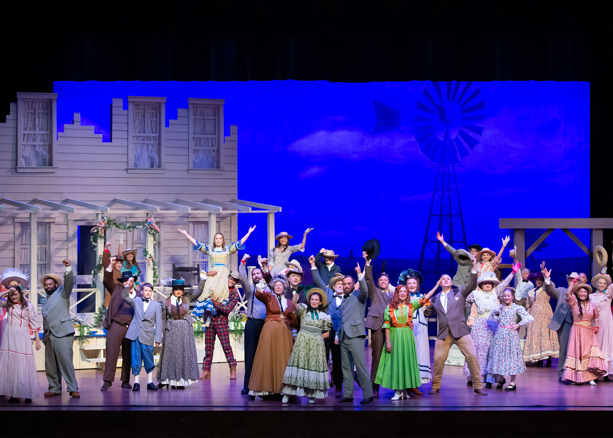 groups of adults and children in early 20th century costumes 
