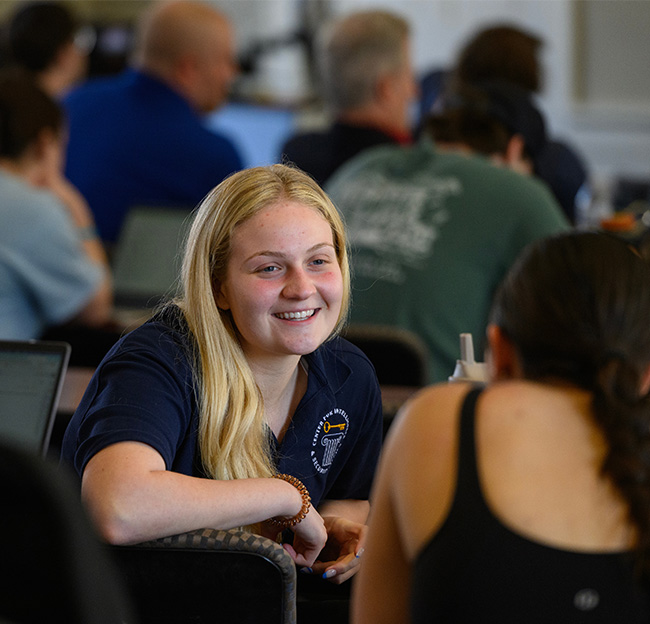 An Ole Miss student speaks with peers during a CISS event.