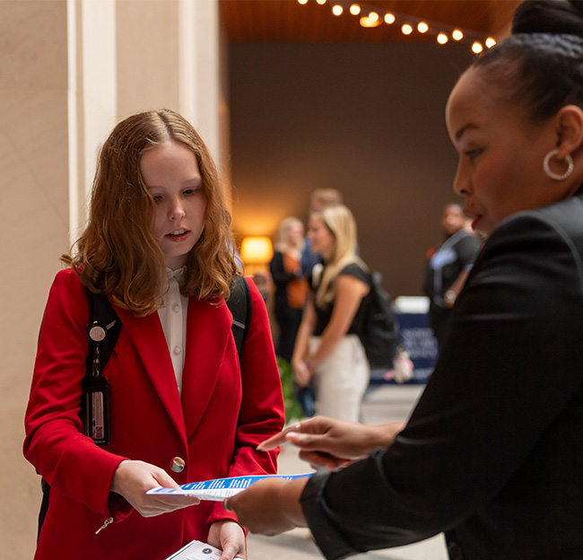 An Ole Miss student looks at a brochure during a CISS event.
