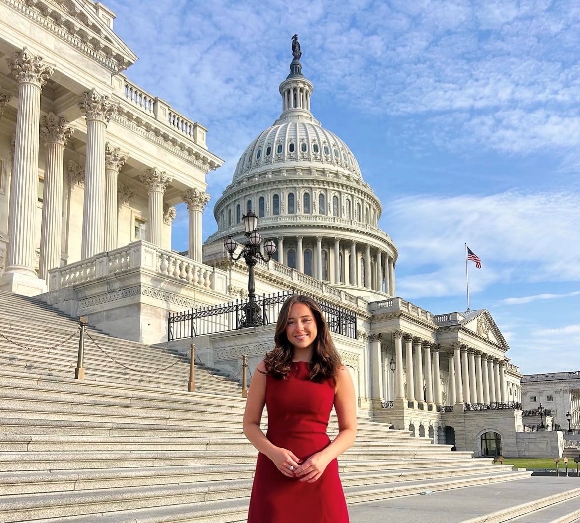 Woman standing on the steps of the DC capitol building