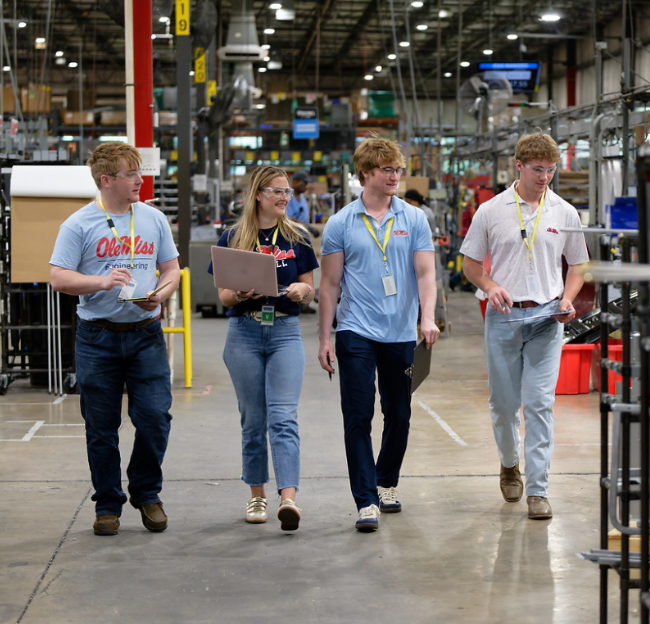 CME students working on factory floor