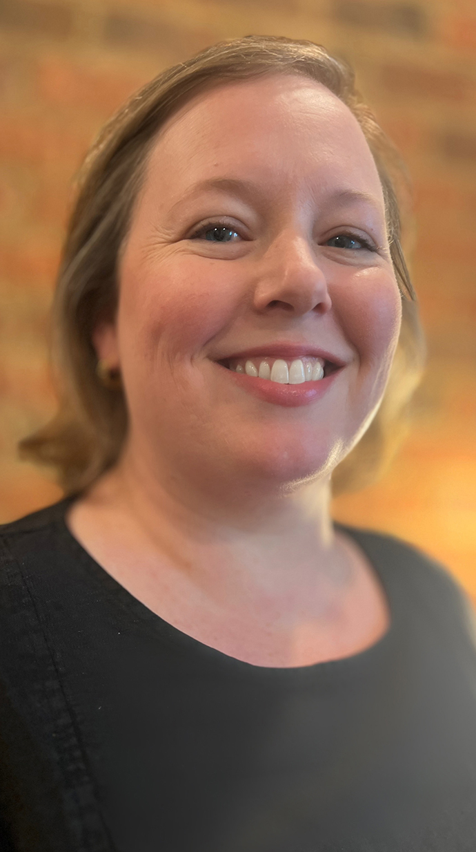 Photo of a woman wearing a black shirt.
