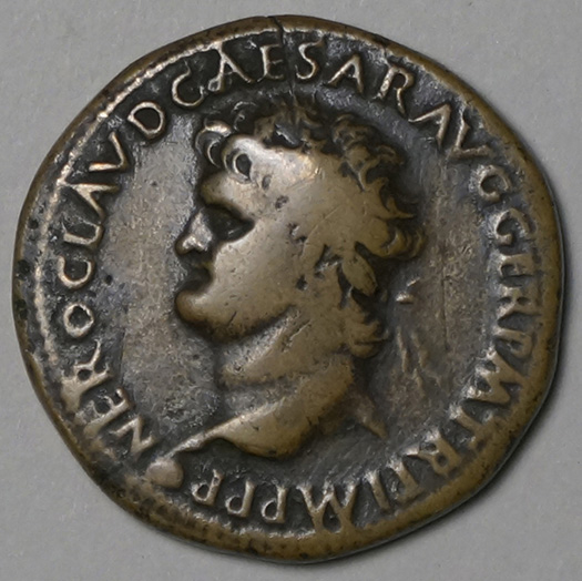 A bronze Roman coin featuring a left-facing portrait of Emperor Nero in profile, surrounded by an inscribed Latin legend along the edge.