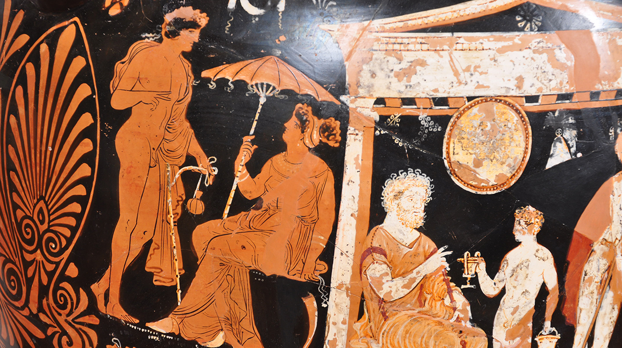 Detail of an ancient Greek red-figure pottery scene showing several figures in flowing garments against a black background, including a seated woman holding a parasol, a standing nude figure, and a bearded man gesturing toward a smaller figure beneath an architectural structure, with decorative patterns and visible areas of wear.
