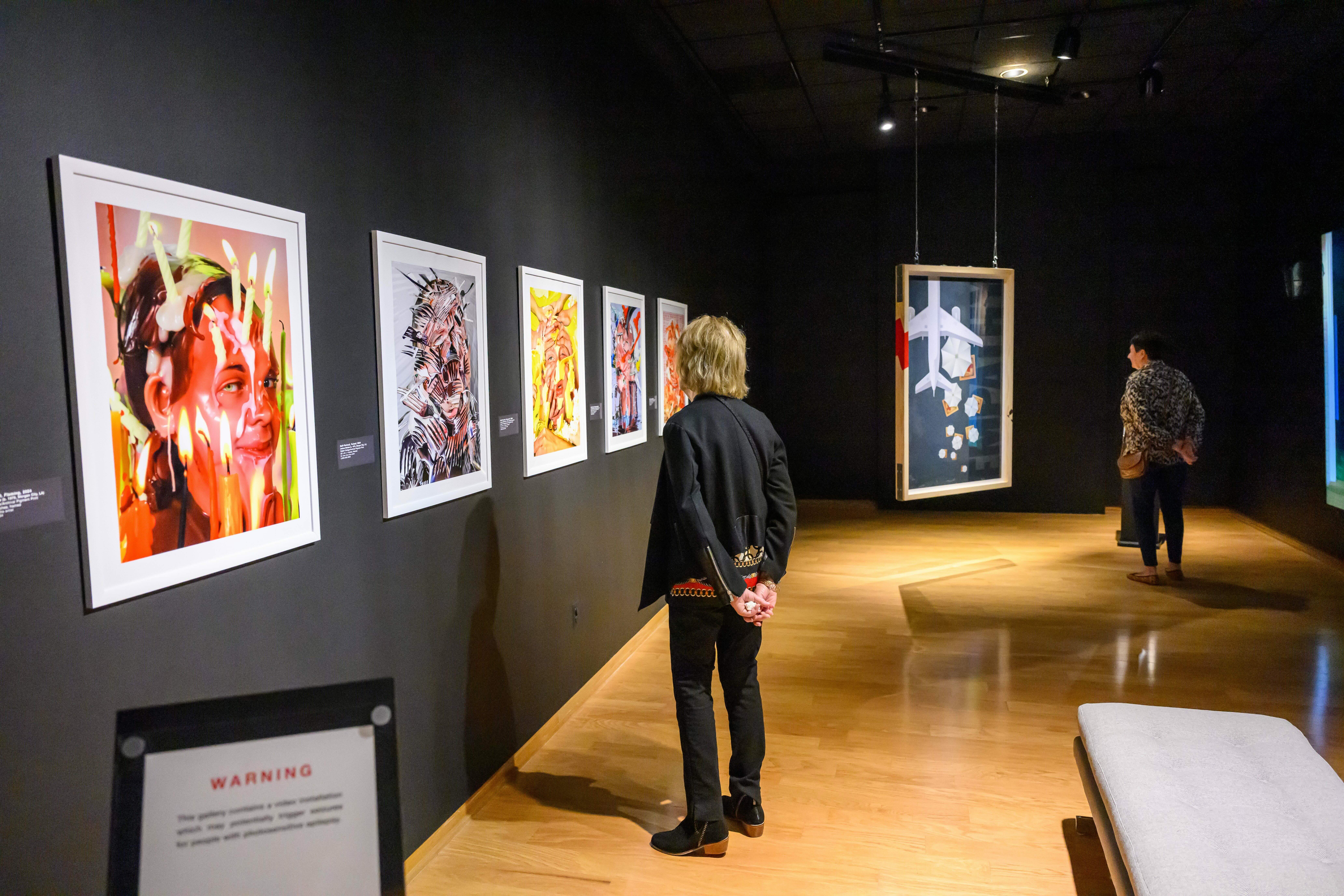 People looking at Art Faculty Show
