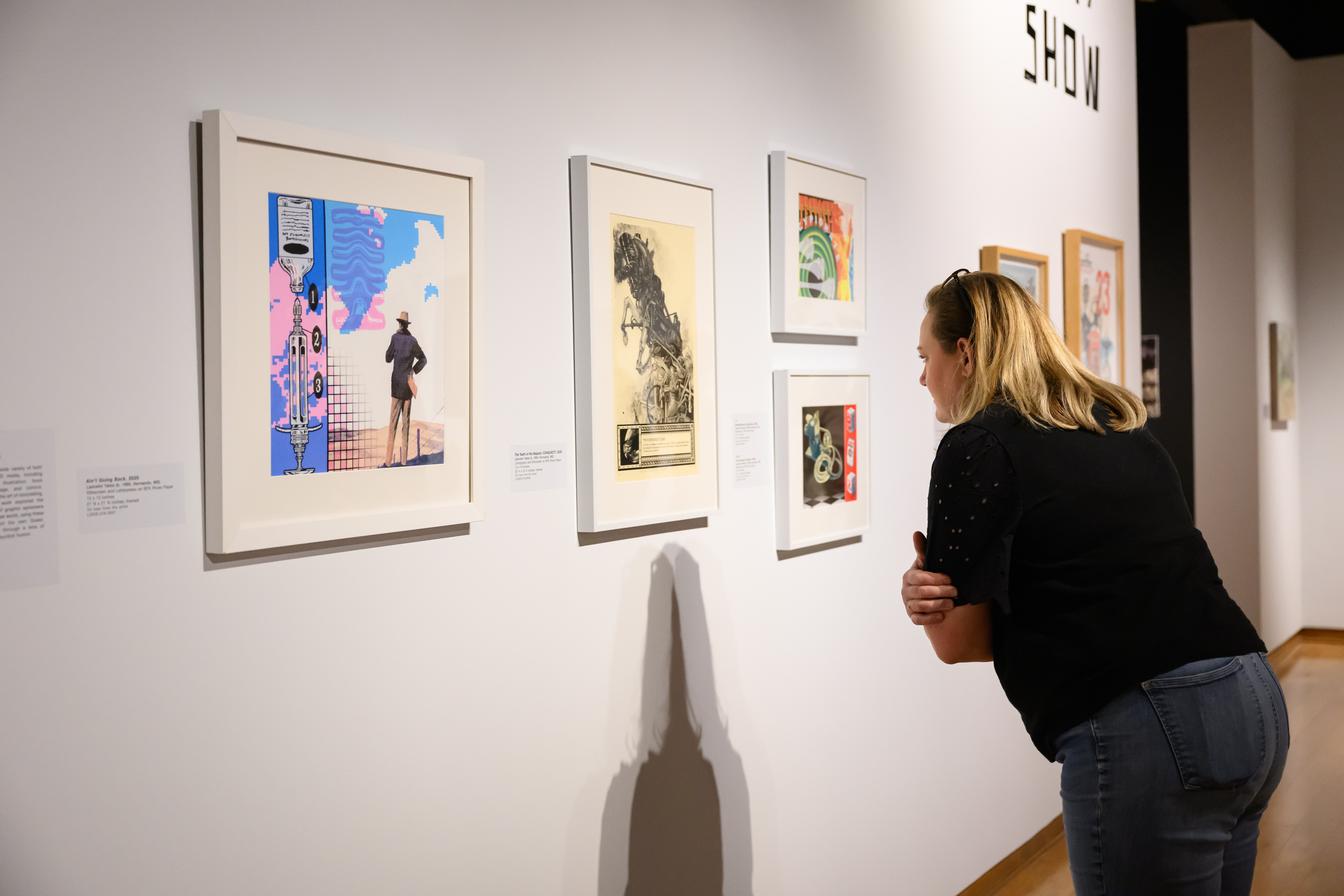 Lady inspecting art