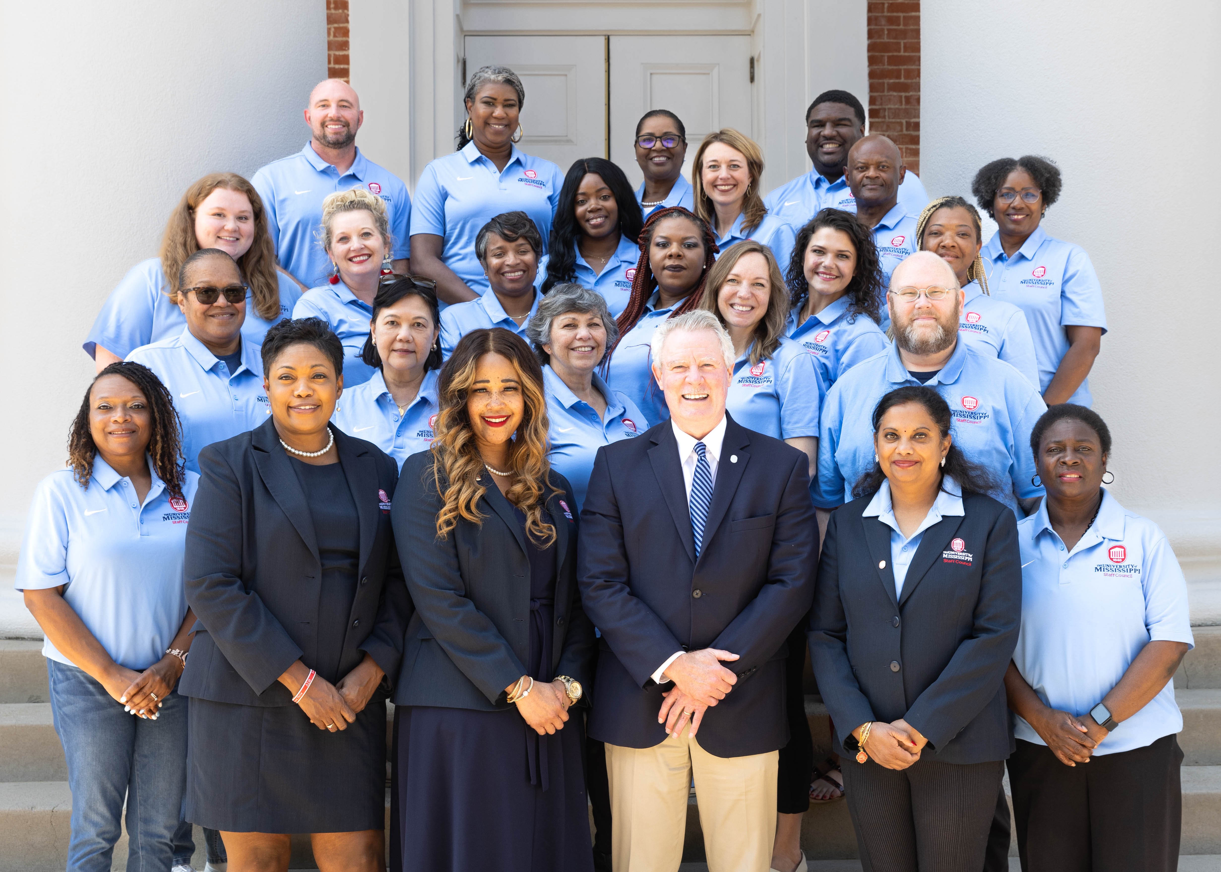 group photo of staff council members with chancellor