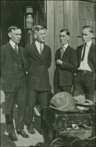 Oxford, MS Train Depot, Four young men waiting for the train c. 1910-1925