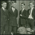 Image of four young men waiting for the train. Howorth Photograph Collection.Circa 1910-1925.