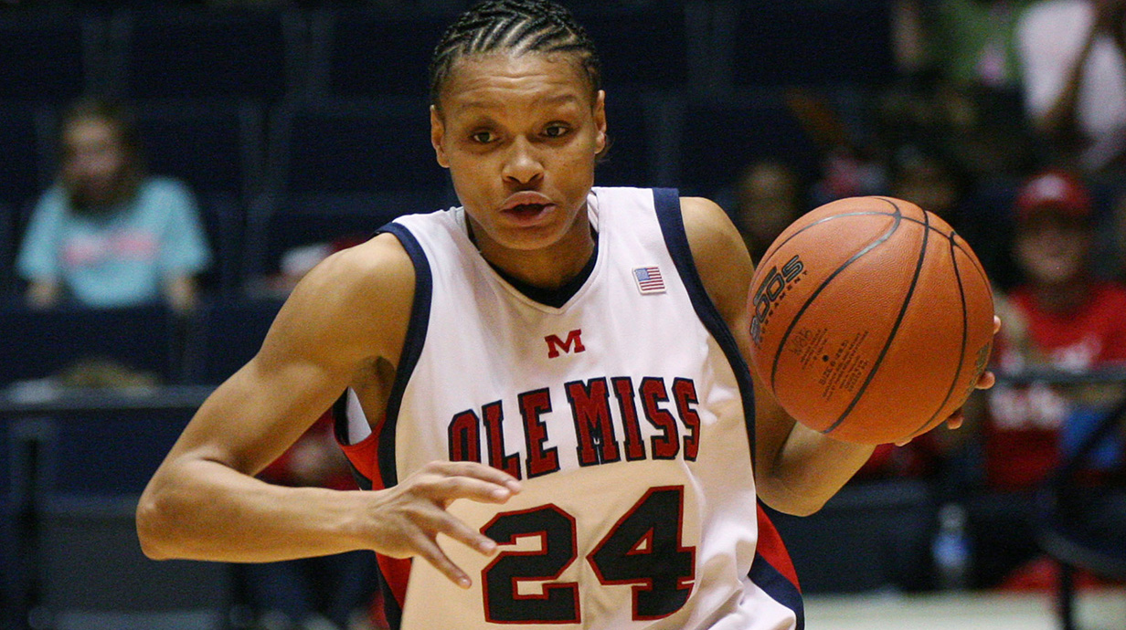 Women's basketball player dribbling a ball