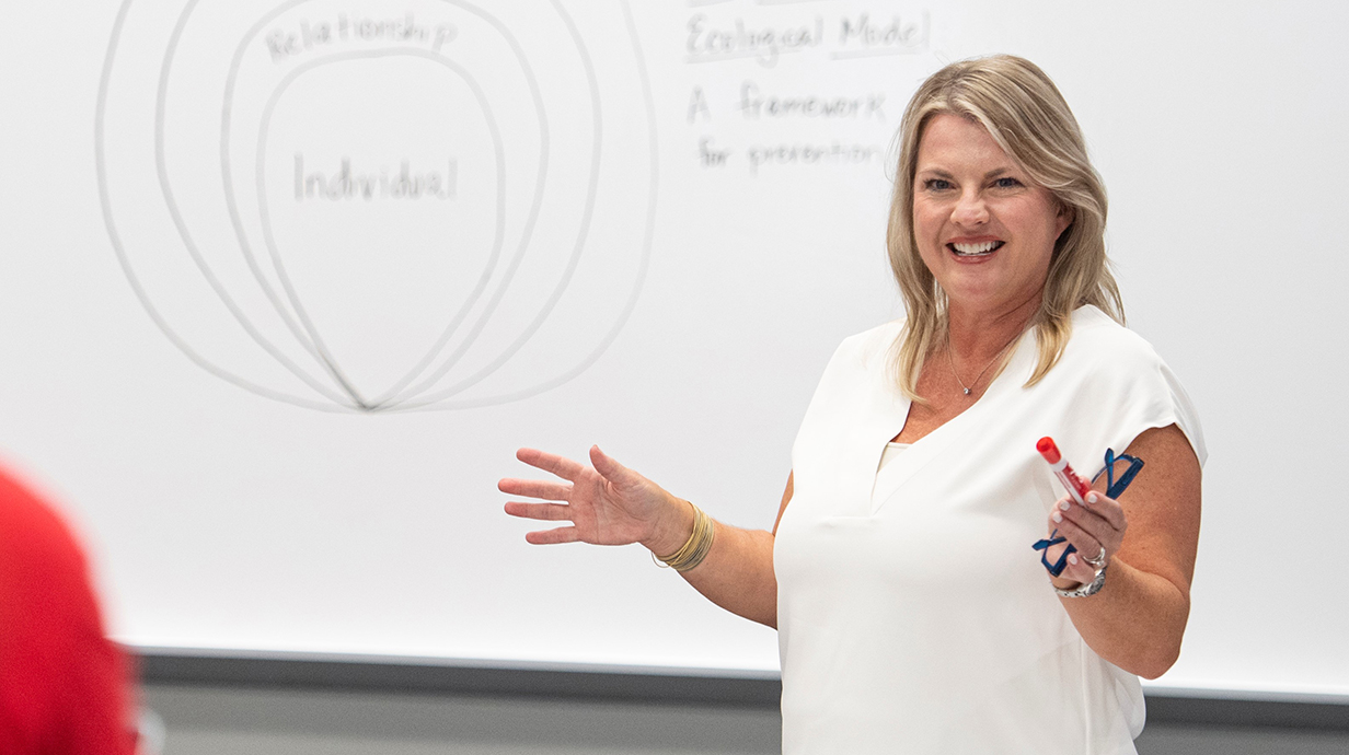 Allison Ford-Wade lecturing in a classroom