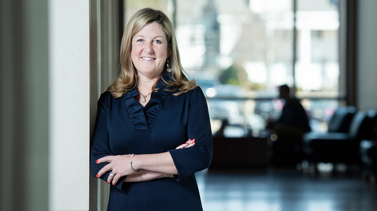 Susan Duncan stands in the School of Law.