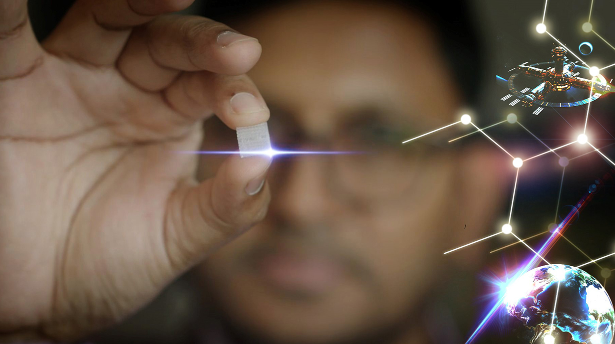 Man holds 3D-printed pill beside photos of space station and Earth