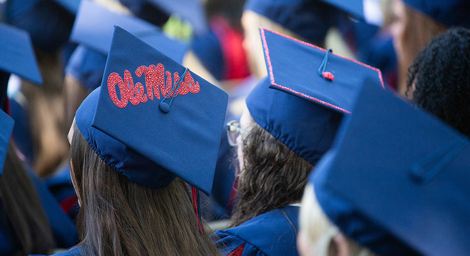 A graduation cap is decorated with a red Ole Miss logo.