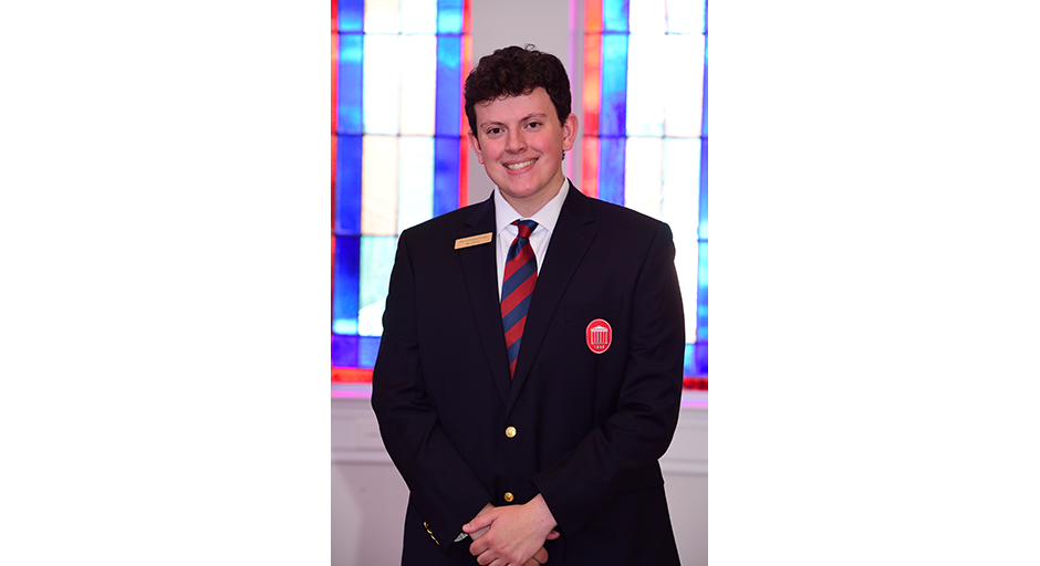 Portrait of a young man wearing a suit.