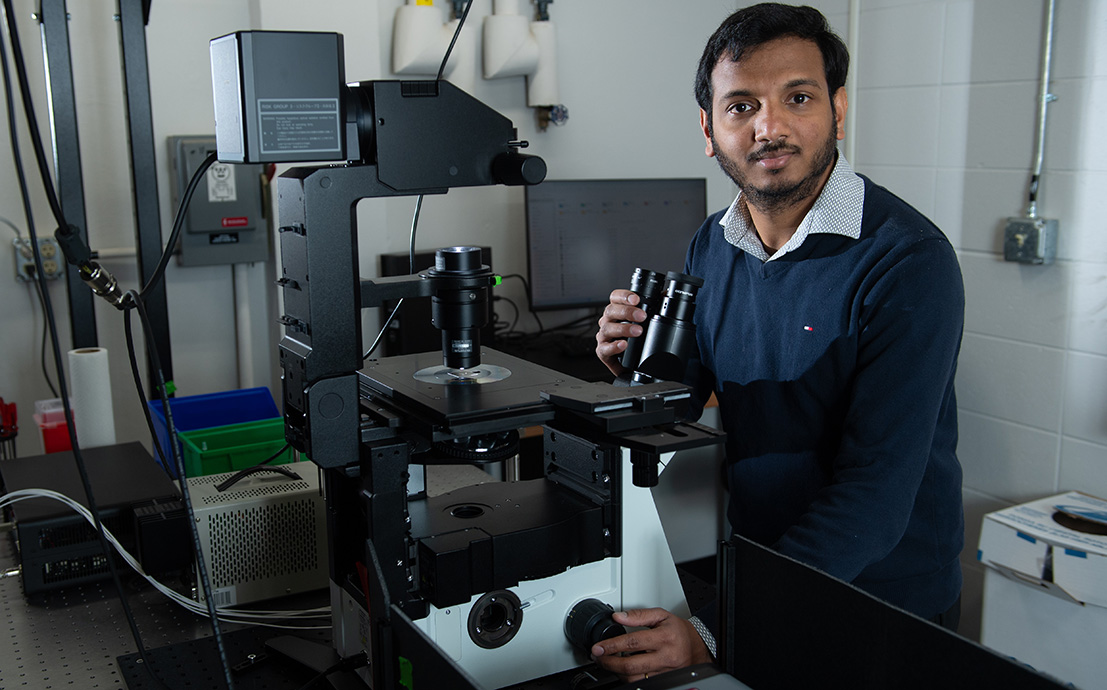 Vignesh Sundaresan poses for a photo in his lab. 