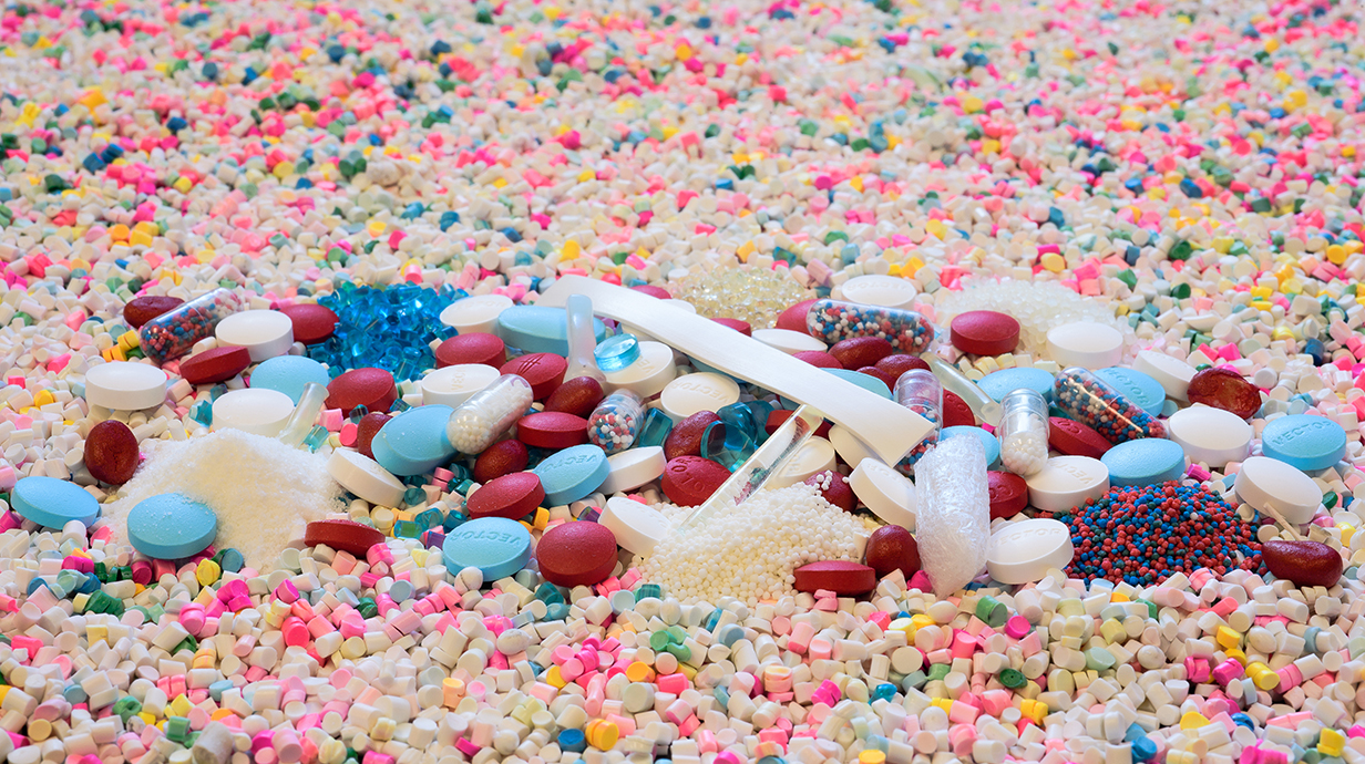 Photo illustration of a pile of pills and capsules.
