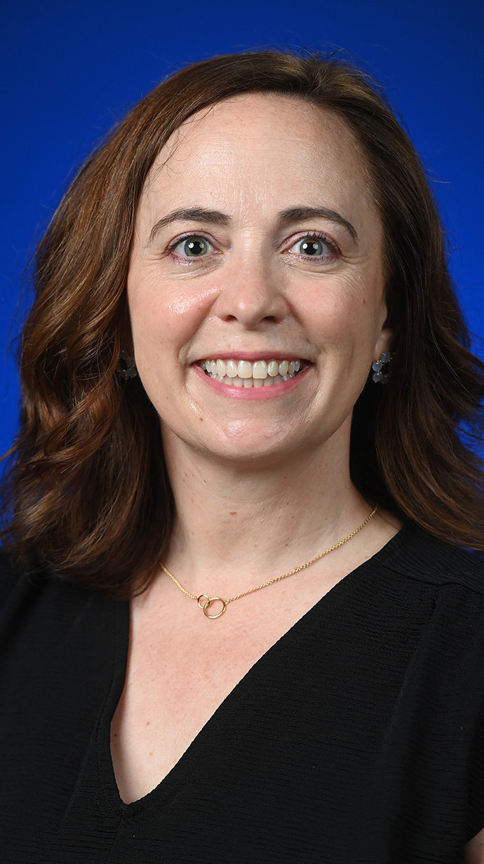 Headshot of a woman wearing a black blouse.