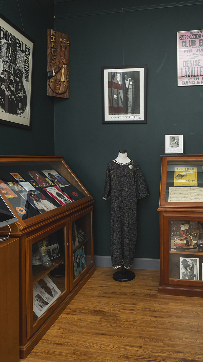 Display cases are filled with artifacts in an archive room.