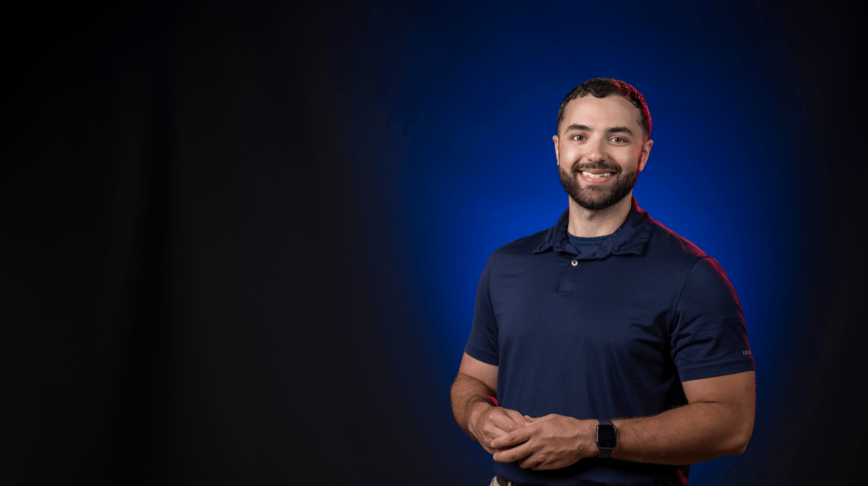 Image of Ahmed Orabi in front of a blue background.