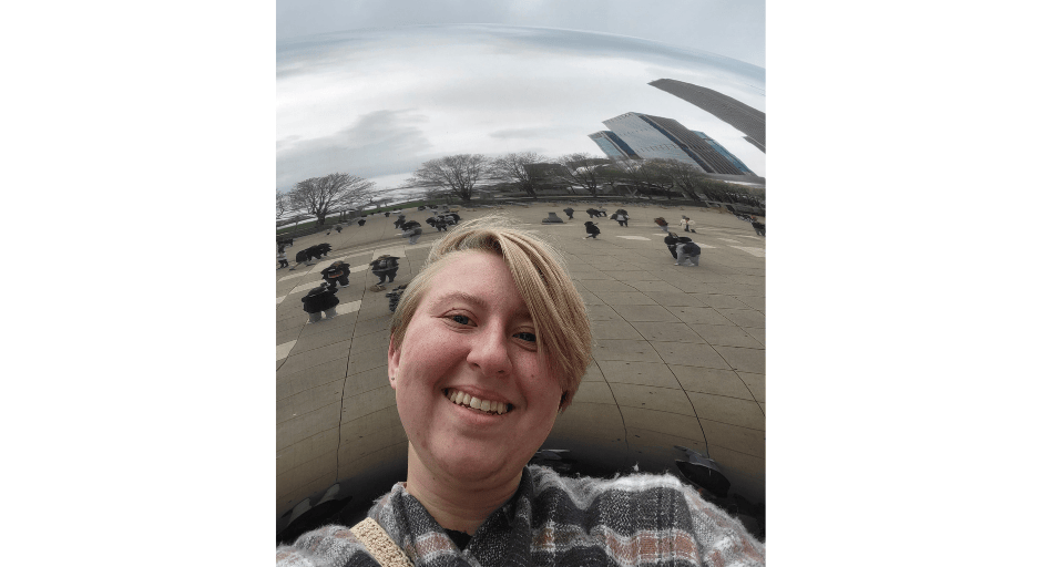 Image of Gwen Pfrenger posing in front of the Chicago Bean.