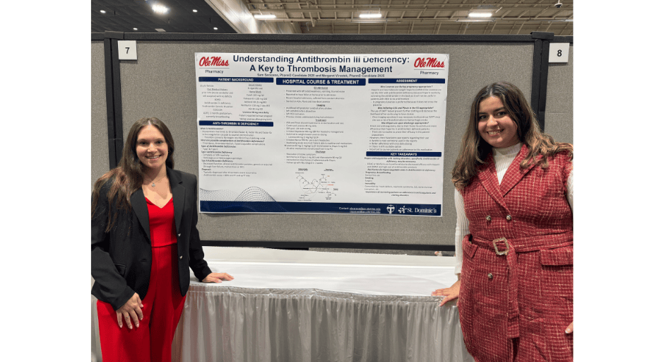 An image of Samantha Saraceno and classmate Margaret Virostek in front of their presentation.