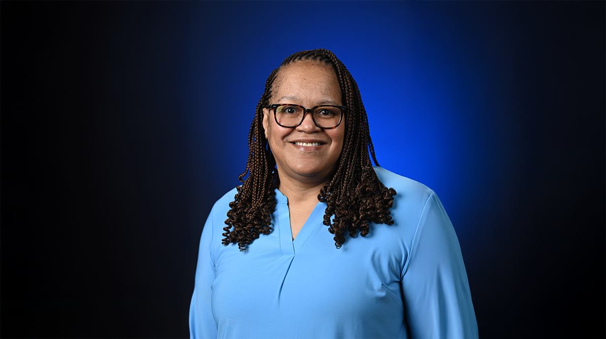 Image of Vernita Ivy in front of a blue backdrop.