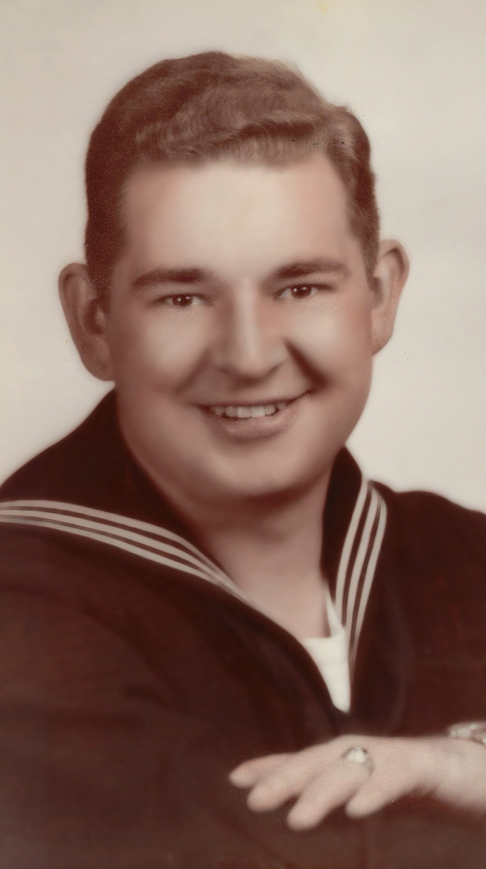 Photo of a young man wearing a naval seaman's uniform.