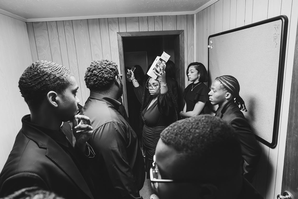 Choir director Honesty Shaw addressing the Gospel Choir ensemble as they prepare to take the stage at Clear Creek Missionary Baptist Church.