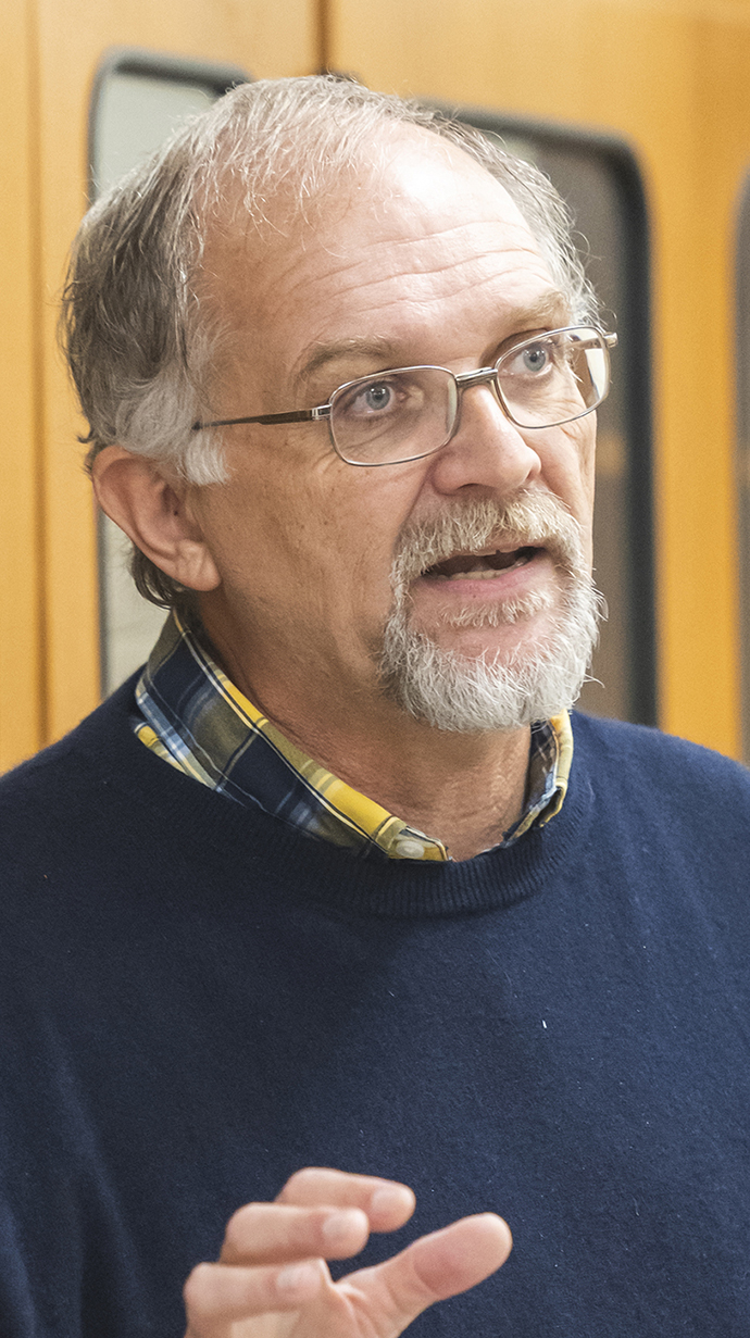 Headshot of a man speaking.