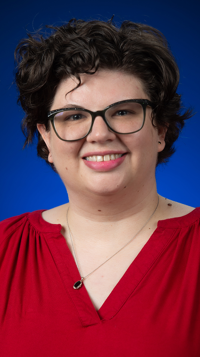 Headshot of a woman wearing glasses.