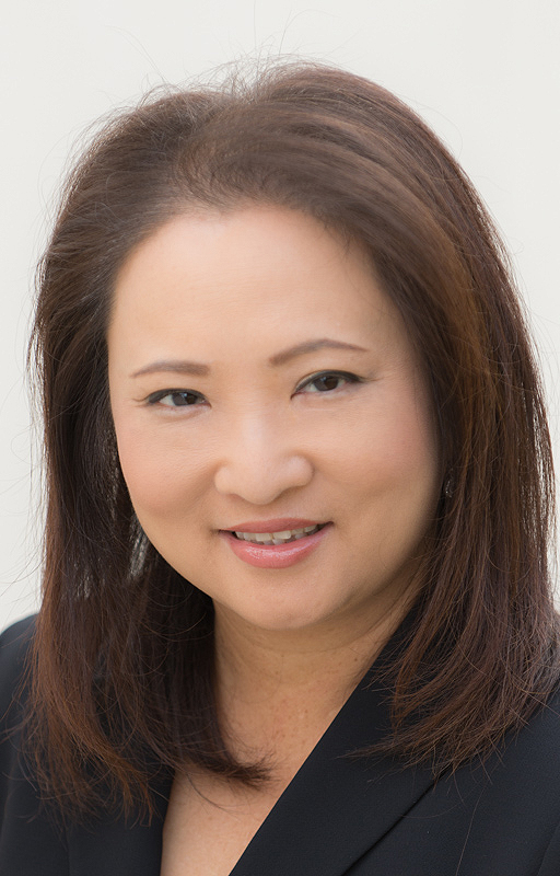 Headshot of a woman wearing a black jacket.