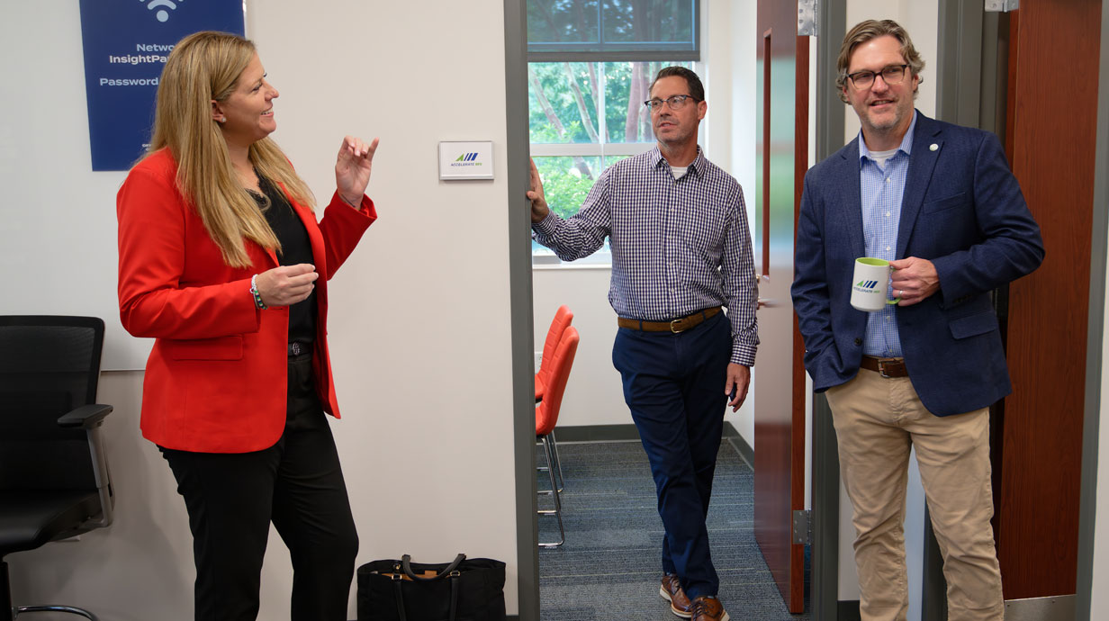 Courtney Taylor (left), executive director of Accelerate MS, takes a tour of Accelerate MS’s new office space with William Nicholas (center), director of economic development and Insight Park, and Ryan Miller, CEO of Oxford Lafayette Incorporated.