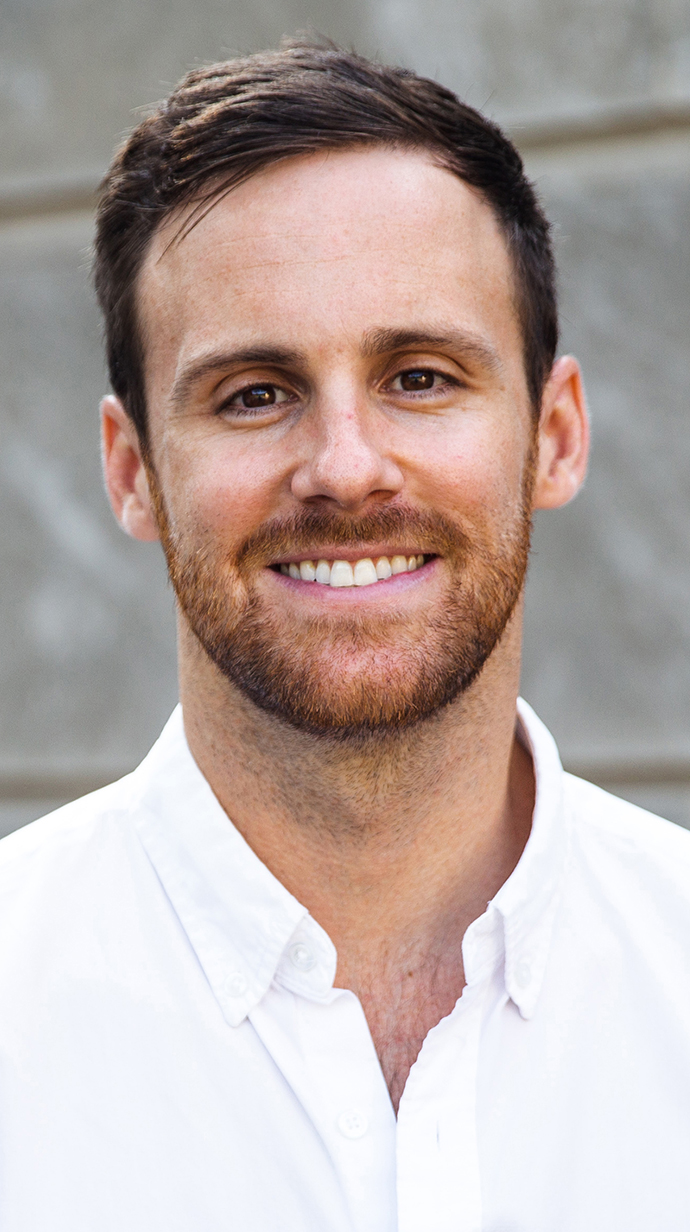 Headshot of a young man wearing a white shirt.
