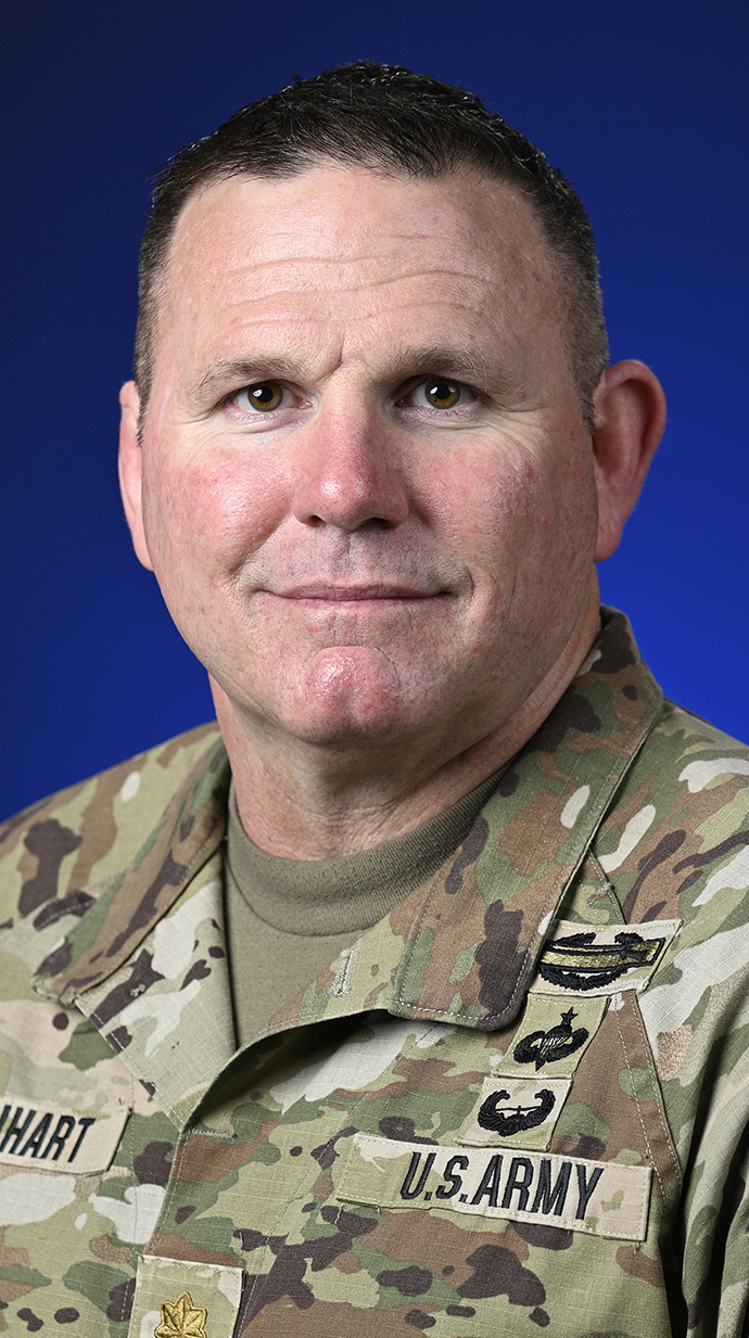 Headshot of a man wearing army fatigues.