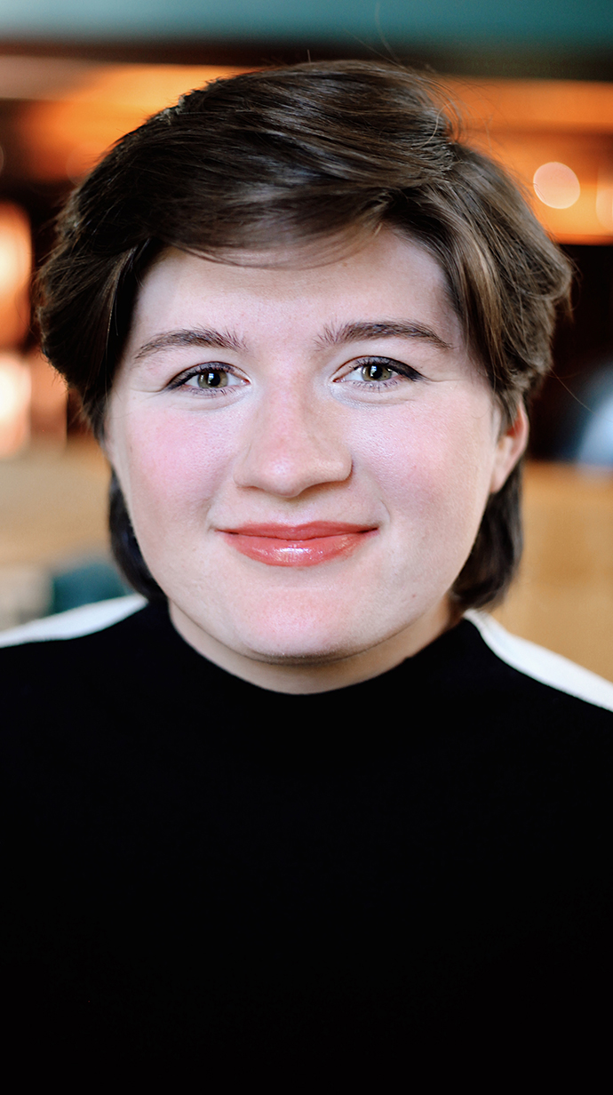 Headshot of a young woman wearing a black sweater.