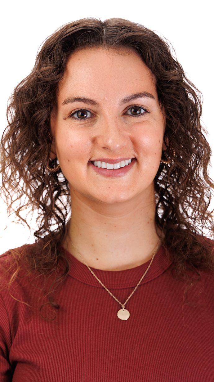 Headshot of a woman wearing a red clouse.