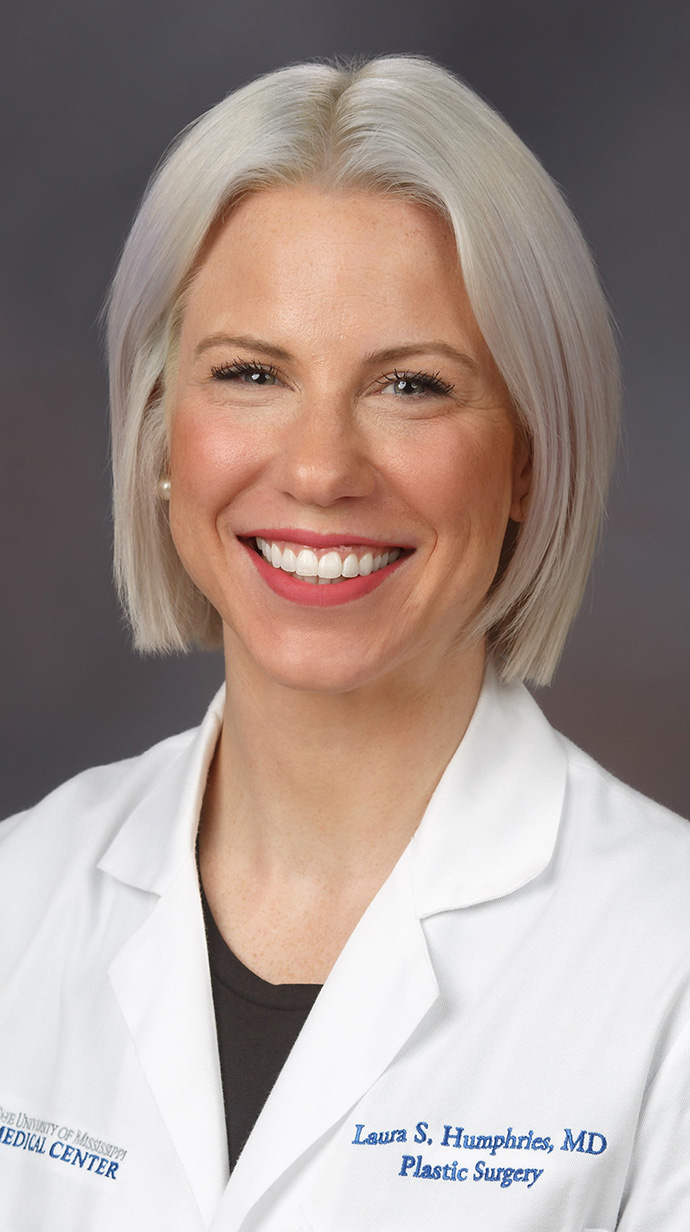 Headshot of a woman wearing a doctor's white coat.