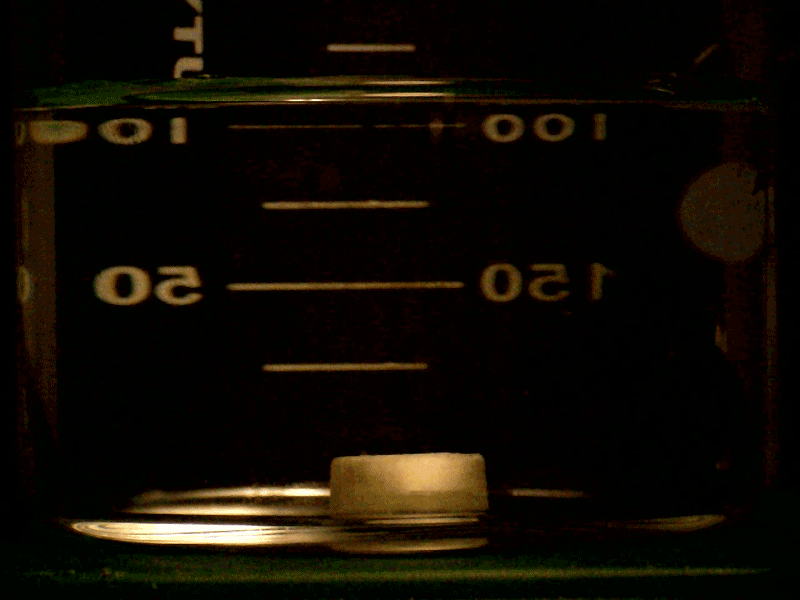 Time-lapse image of a pill dissolving in liquid.