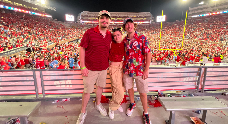 Maxwell Glasser and two friends standing at Vaught Hemingway Stadium after students rushed the field.