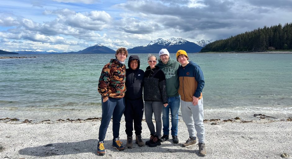 Maxwell Glasser stands with his family while on a trip to Alaska.