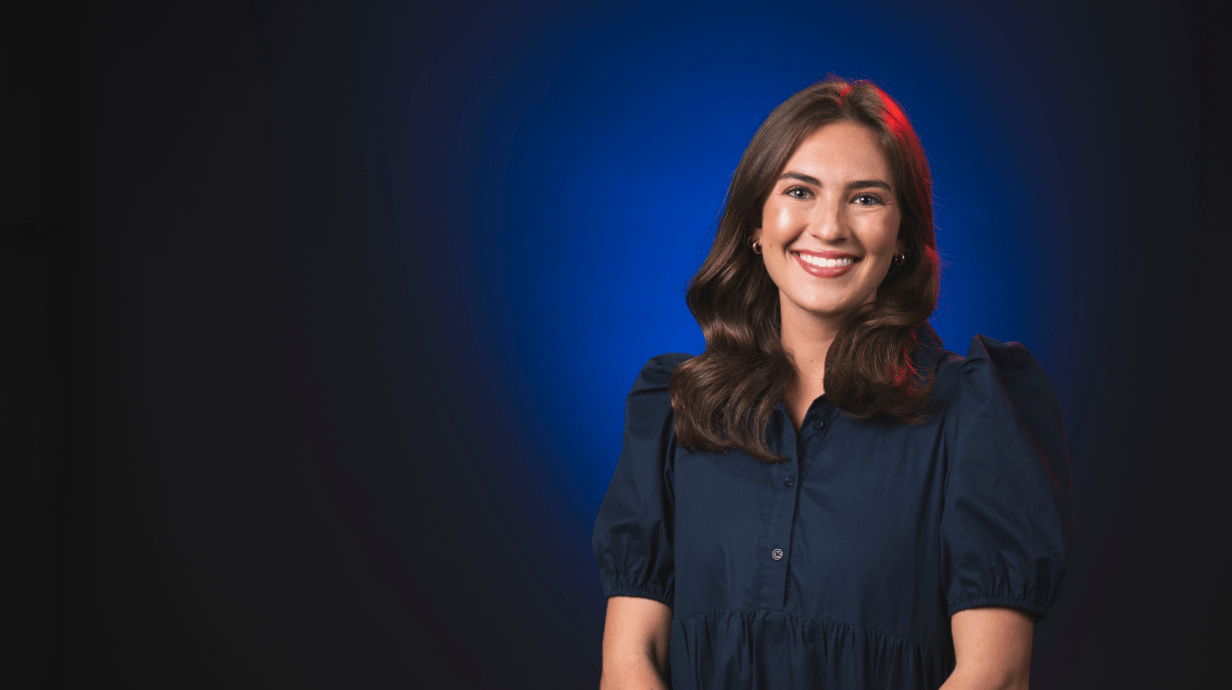 An image of Sadie Keyes in front of a blue backdrop.