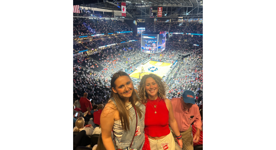 An image of Bay Merrell (left) and Hannah Harbour at the Ole Miss Men's Basketball 2025 Sweet 16 game.